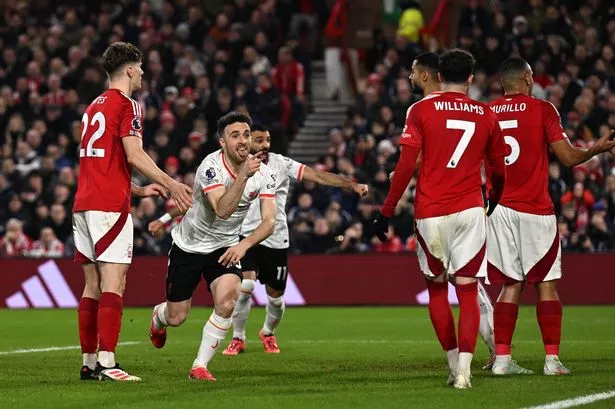 NOTTINGHAM, ENGLAND - JANUARY 14: (THE SUN OUT, THE SUN ON SUNDAY OUT) Diogo Jota of Liverpool celebrates scoring his team's first goal during the Premier League match between Nottingham Forest FC and Liverpool FC at City Ground on January 14, 2025 in Nottingham, England. (Photo by Liverpool FC/Liverpool FC via Getty Images)