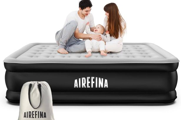 A couple and a baby on Airefina's King Inflatable Air Mattress, available from Amazon.