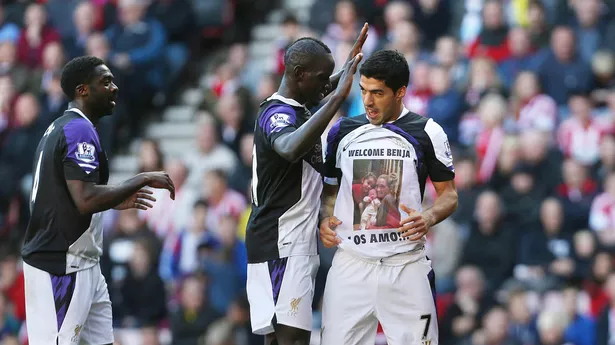 Liverpool's Luis Suarez celebrates scoring their second goal with Mamadou Sakho and Kolo Toure