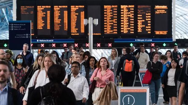 Commuters arrive at Waterloo station during the morning rush hour