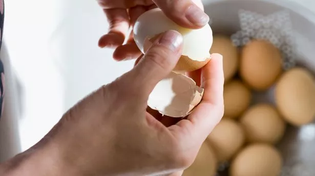 Boiled eggs in hands