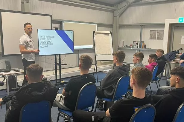 Former AFC Bournemouth winger Marc Pugh giving a nutrition presentation