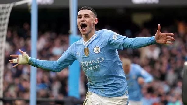 Manchester City's Phil Foden celebrates scoring against Manchester United