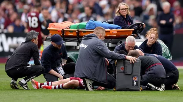 George Earthy of West Ham United receives medical treatment before being stretchered off