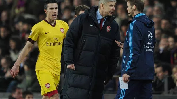 Arsenal Manager Arsene Wenger protests Robin van Persie's red card