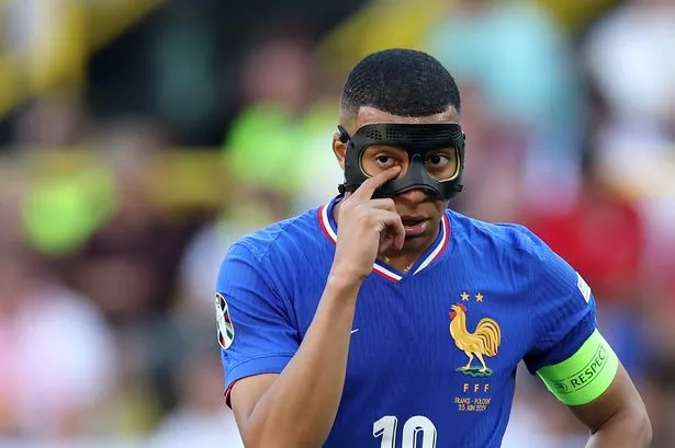 DORTMUND, GERMANY - JUNE 25: Kylian Mbappe of France looks on, whilst wearing a Black Protective Face Mask after breaking his nose during the Group D fixture against Austria, during the UEFA EURO 2024 group stage match between France and Poland at Football Stadium Dortmund on June 25, 2024 in Dortmund, Germany. (Photo by Kevin C. Cox/Getty Images)