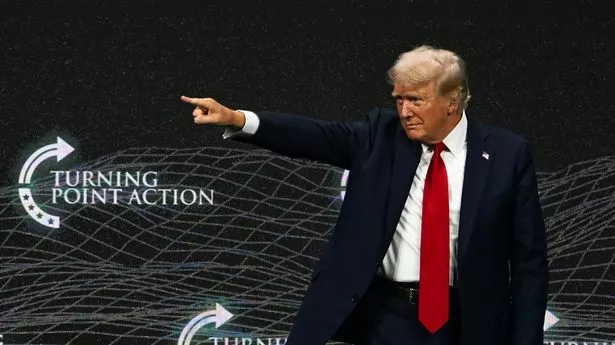 Former US President and 2024 Republican presidential candidate Donald Trump gestures after speaking at Turning Point Action's "The Believers Summit" in West Palm Beach, Florida, on July 26, 2024. (Photo by CHANDAN KHANNA / AFP) (Photo by CHANDAN KHANNA/AFP via Getty Images)