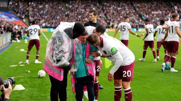 West Ham United's Jarrod Bowen (right) consoles the ball boy