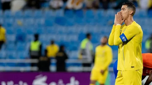 RIYADH, SAUDI ARABIA - FEBRUARY 14: Cristiano Ronaldo (L) of Al-Nassr reacts during the AFC Champions League round of 16 match between Al-Nassr and Al-Fayha at Prince Faisal bin Fahd Stadium in Riyadh, Saudi Arabia on February 14, 2024. (Photo by Mohammed Saad/Anadolu via Getty Images)