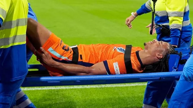 Nathan Ake being stretchered off for the Netherlands