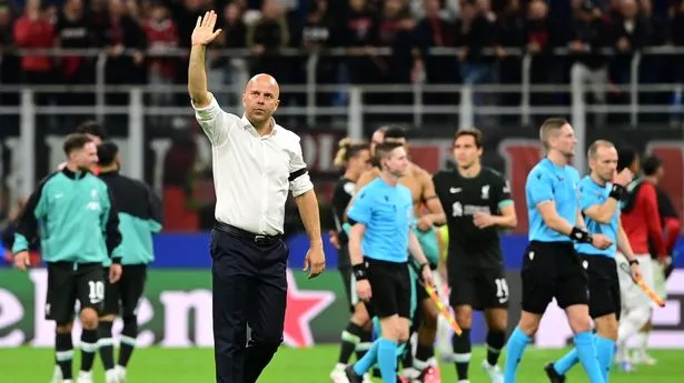 Liverpool's Dutch coach Arne Slot celebrates after beating AC Milan at the San Siro