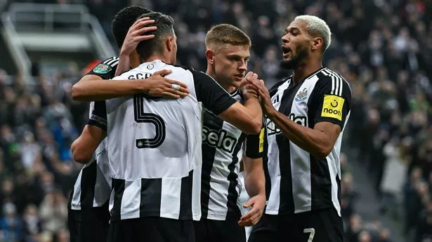 Newcastle players celebrate their goal against AFC Wimbledon