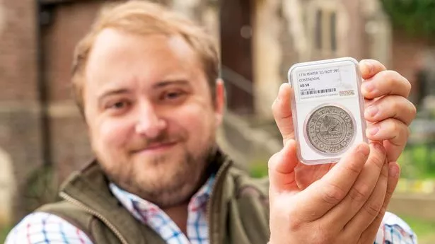 Joseph Trinder, Auctioneer and Managing Director of Wotton Auction Rooms, with the ultra rare Continental Currency Dollar