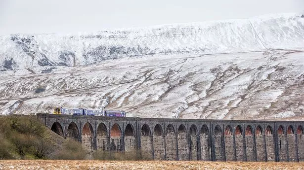 British Rail Class 158 Express Sprinter makes its way across the Ribblehead viaduct