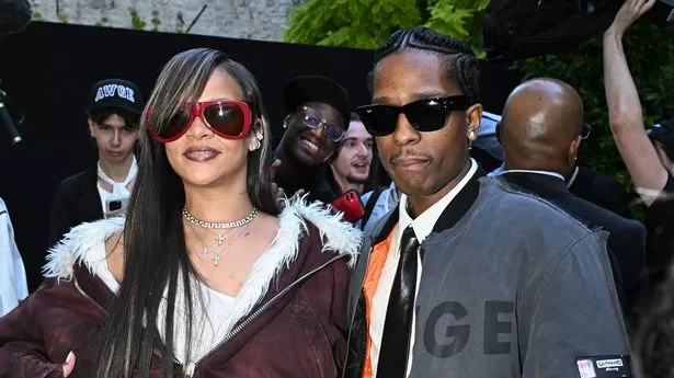 PARIS, FRANCE - JUNE 21: (EDITORIAL USE ONLY - For Non-Editorial use please seek approval from Fashion House) Rihanna and Asap Rocky attend the A$AP Rocky X American Sabotage by AWGE Menswear Spring/Summer 2025 show as part of Paris Fashion Week on June 21, 2024 in Paris, France. (Photo by Stephane Cardinale - Corbis/Corbis via Getty Images)