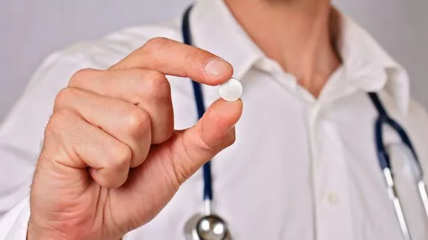 Doctor holding pill medicine close up. Health care and medical concept