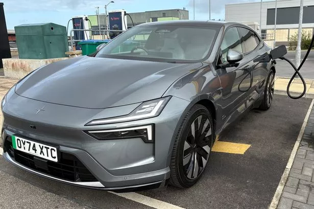 The Polestar 4 connected to a charger