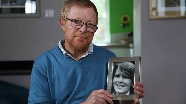 Richard Lamplugh holding photograph of his sister Suzy Lamplugh.