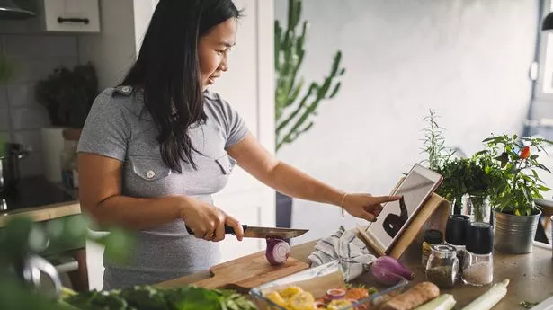 women at home making healthy meal