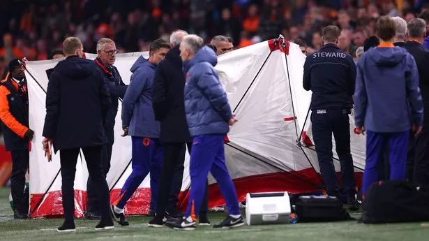 Screens were put up as an individual received medical attention during Netherlands vs Hungary