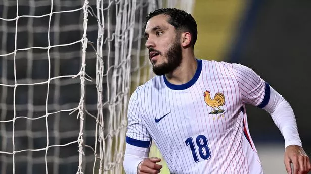 Lyon and France forward Rayan Cherki celebrates a goal