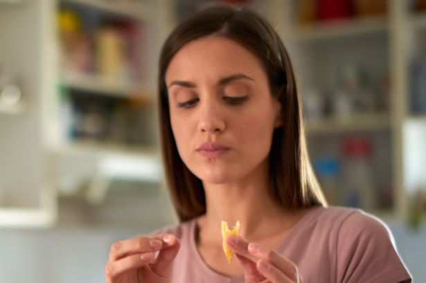 Woman eating cheese