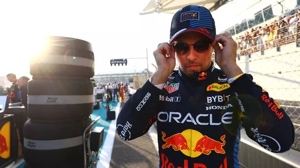 ABU DHABI, UNITED ARAB EMIRATES - DECEMBER 08: Sergio Perez of Mexico and Oracle Red Bull Racing prepares to drive on the grid during the F1 Grand Prix of Abu Dhabi at Yas Marina Circuit on December 08, 2024 in Abu Dhabi, United Arab Emirates. (Photo by Mark Thompson/Getty Images)