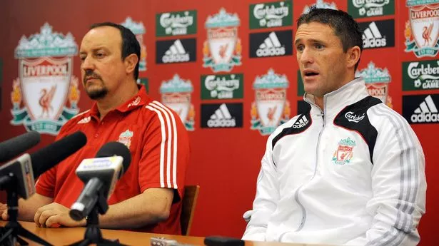 Liverpool manager Rafael Ben?tez (L) sits next to new signing Robbie Keane during a press conference at the club's Melwood training complex, in Liverpool, north-west England, on July 29, 2008.