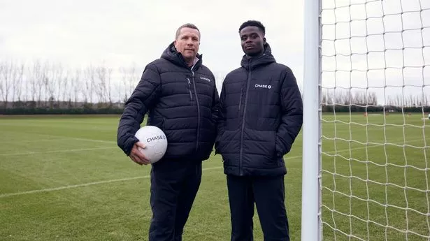 Bukayo Saka (right) with coach Colin Nixon