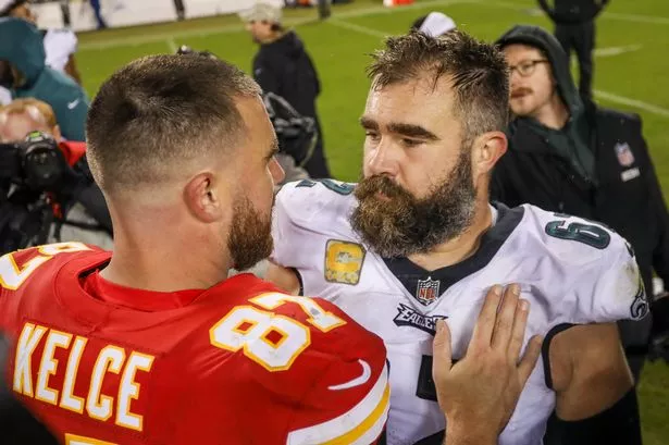 Philadelphia Eagles center Jason Kelce (62) and Kansas City Chiefs tight end Travis Kelce (87) hug after an NFL football game between the Philadelphia Eagles and Kansas City Chiefs on Nov 20, 2023 at GEHA Field at Arrowhead Stadium in Kansas City, MO. 