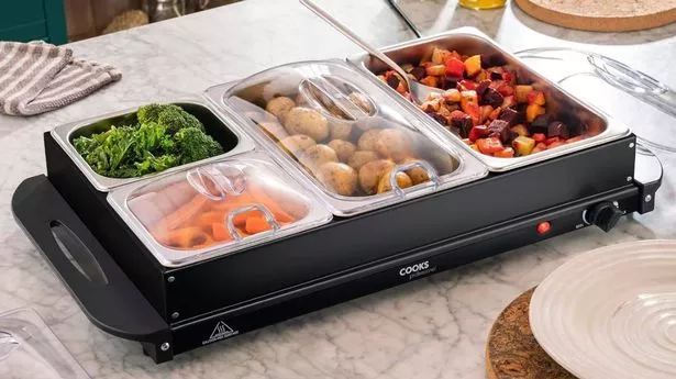 The Cooks Professional 4-Section Buffet Warmer on a table with food in.