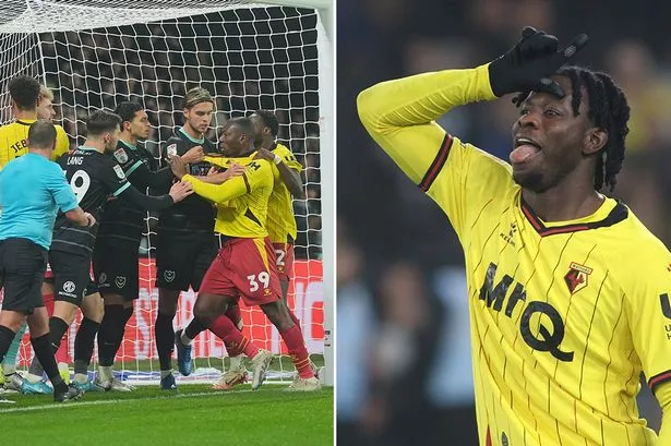 Kwadwo Baah of Watford taunts the Portsmouth fans 