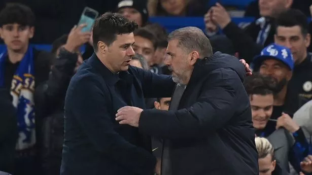 Chelsea's Argentinian head coach Mauricio Pochettino (L) and Tottenham Hotspur's Greek-Australian Head Coach Ange Postecoglou (R) embrace after the English Premier League football match between Chelsea and Tottenham Hotspur at Stamford Bridge in London on May 2, 2024