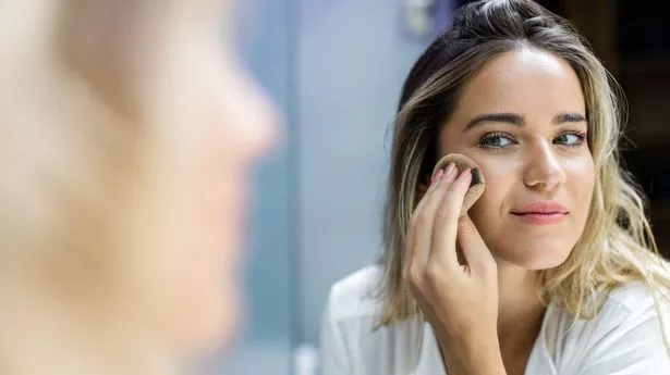 Woman applying make-up