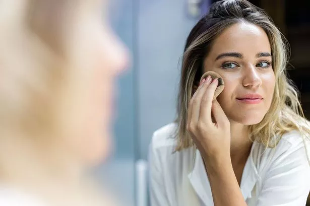 Woman applying make-up