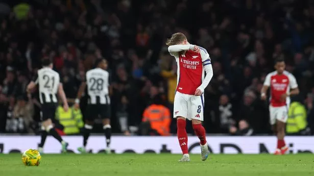 LONDON, ENGLAND - JANUARY 07: Martin Odegaard of Arsenal appears dejected after Anthony Gordon of Newcastle United (not pictured) scores his team's second goal during the Carabao Cup Semi Final First Leg match between Arsenal and Newcastle United at Emirates Stadium on January 07, 2025 in London, England. (Photo by Alex Pantling/Getty Images)