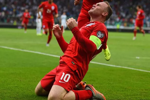 Wayne Rooney celebrates scoring the third goal for England