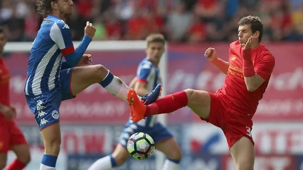 Alex Gilby challenges Jon Flanagan