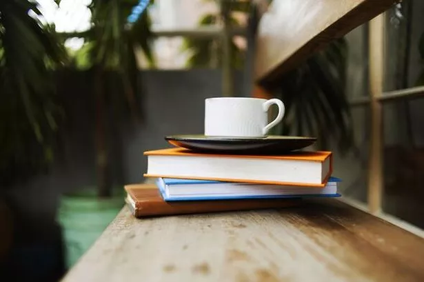 Pile of books and mug