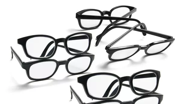 Selection of black framed glasses on white background