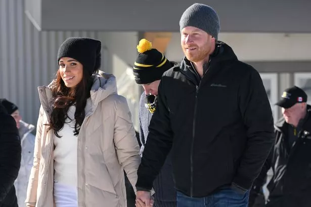 Meghan and Harry outdoors in coats and hats