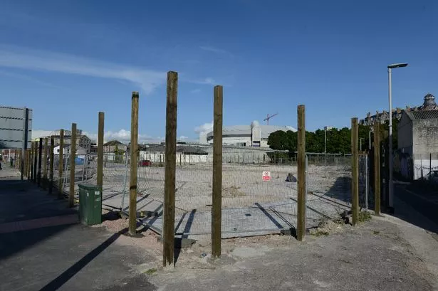 Wooden planks have been put in the ground surrounding the site