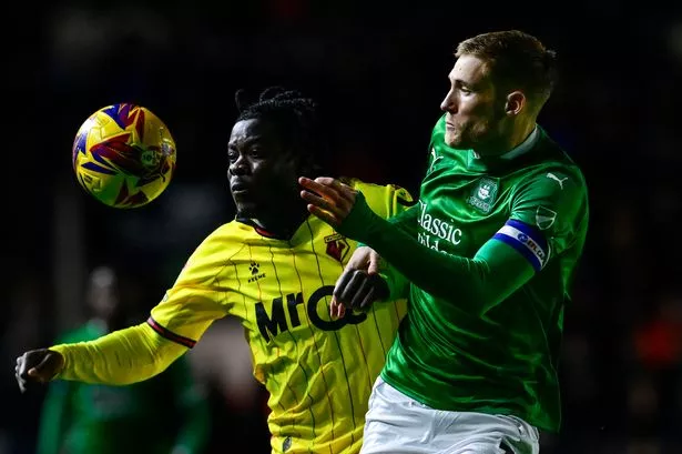 Argyle defender Lewis Gibson battles for the ball with Watford's Kwadwo Baah during the Championship match at Home Park on Friday, November 22, 2024 - Photo: Phil Mingo/PPAUK