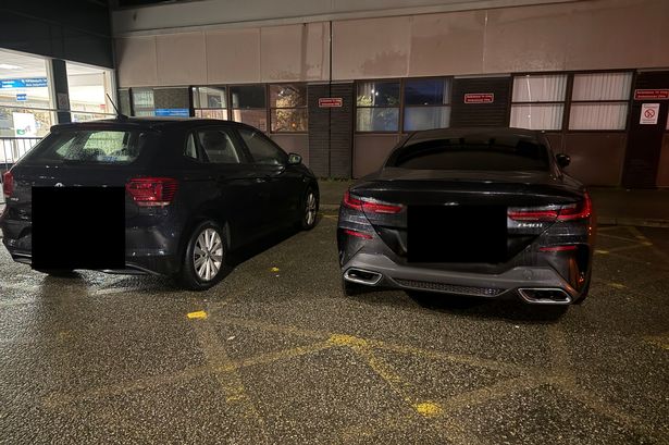 Cars parked in ambulance bays at Ysbyty Gwynedd