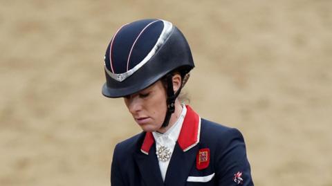 Charlotte Dujardin wearing a helmet