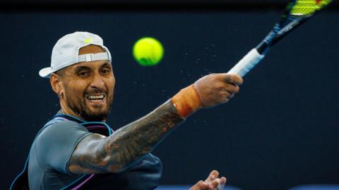 Nick Kyrgios hits a backhand return at the Brisbane International