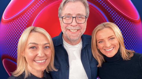 Kelly Cates, Mark Chapman and Gabby Yorath pose in front of the MOTD2 badge