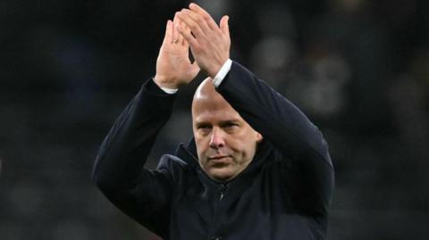 Liverpool boss Arne Slot acknowledges the fans at the end of the emphatic victory at Spurs