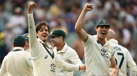 Sam Konstas (left) and Pat Cummins celebrate the fourth Test win over India