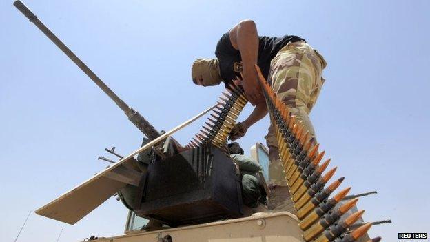 An Iraqi soldier loads ammunition before departing for a patrol in the town of Jurf al-Sakhar, south of Baghdad